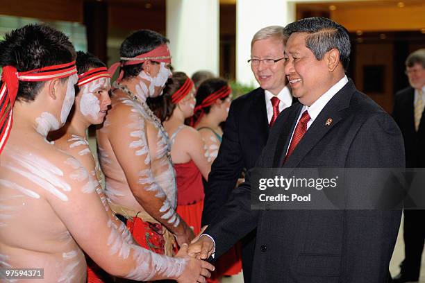 Australian Prime Minister Kevin Rudd and the President of Indonesia Susilo Bambang Yudhoyono greet aboriginal dancers at Parliament House on March...