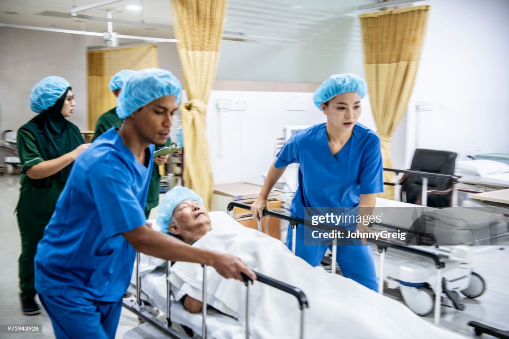 Medical staff  rushing patient to operating theatre