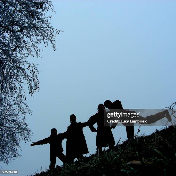 silhouette of four women - lucy lambriex stock-fotos und bilder