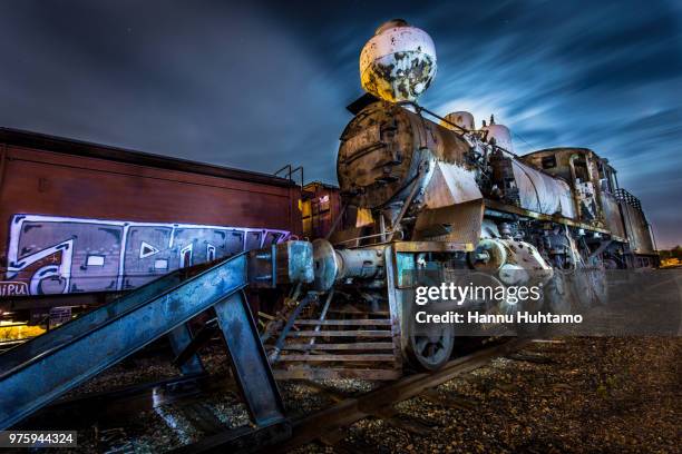 mystery train - train yard at night stock pictures, royalty-free photos & images