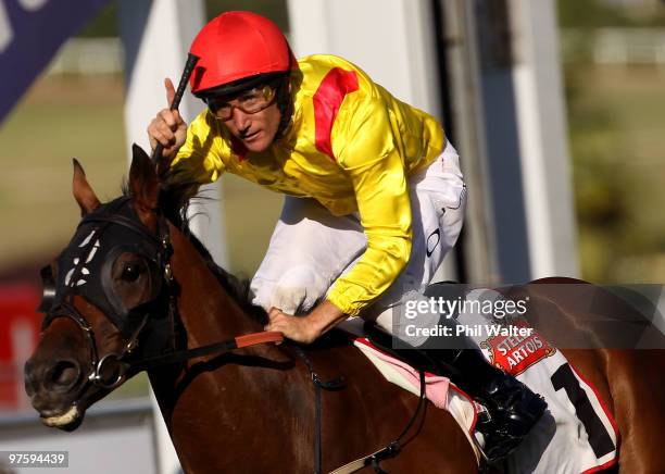 Damien Oliver riding Zavite celebrates winning the Auckland Cup during the Auckland Cup Day meeting at Ellerslie Racecourse on March 10, 2010 in...