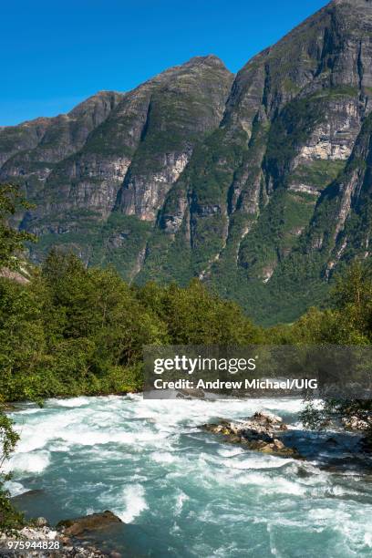 river through the mountains near briksdals glacier, fjordane county, norway. - verwaltungsbezirk sogn og fjordane stock-fotos und bilder