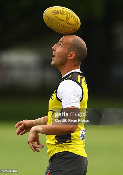 Tadhg Kennelly of the Swans juggles a ball on his head during a Sydney Swans AFL training session at Lakeside Oval on March 10, 2010 in Sydney,...