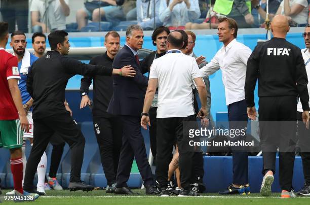 YIran coach Carlos Queiroz and Morocco coach Herve Renard are seen during the 2018 FIFA World Cup Russia group B match between Morocco and Iran at...