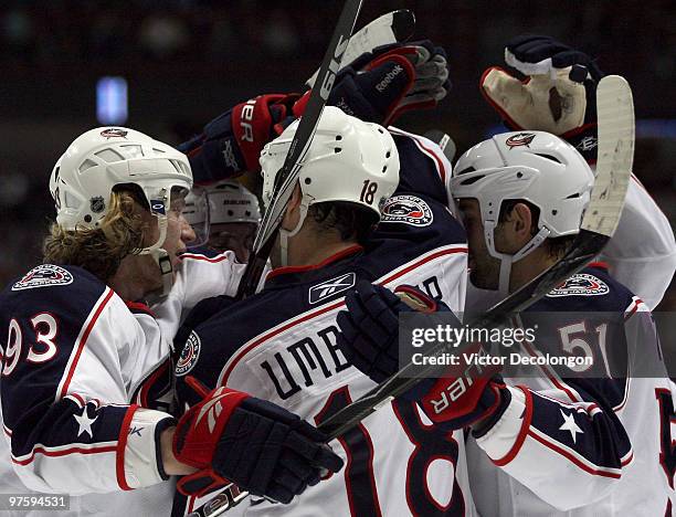 Jakub Voracek of the Columbus Blue Jackets and his teammates celebrate with Fedor Tyutin after Tyutin's second-period goal against the Anaheim Ducks...