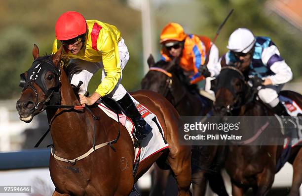 Damien Oliver riding Zavite leads the field to win the Auckland Cup during the Auckland Cup Day meeting at Ellerslie Racecourse on March 10, 2010 in...