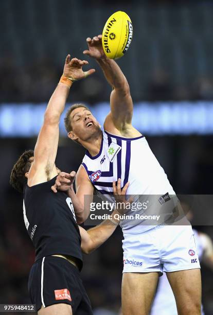 Levi Casboult of the Blues and Aaron Sandilands of the Dockers compete in the ruck during the round 13 AFL match between the Carlton Blues and the...