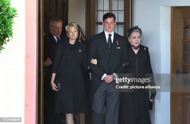 May 2018, Germany, Altshausen: Duchess Marie of Wuerttemberg , her son Duke Wilhelm of Wuerttemberg and Duchess Diane of Wuerttemberg leave the...