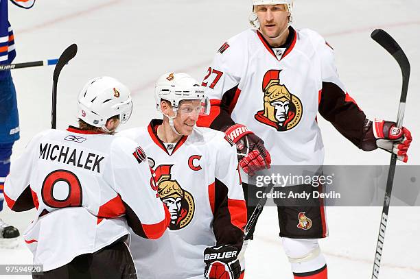 Milan Michalek, Daniel Alfredsson and Alexei Kovalev of the Ottawa Senators celebrate a third-period goal against the Edmonton Oilers at Rexall Place...