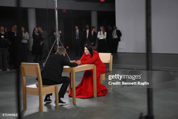 Artist Marina Abramovic performs during the "Marina Abramovic: The Artist is Present" exhibition opening night party at The Museum of Modern Art on...