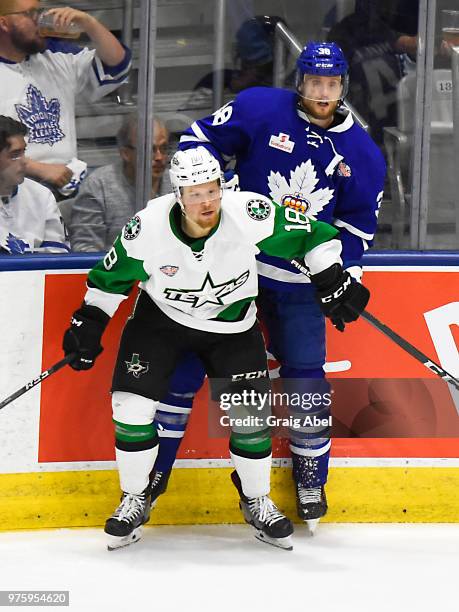 Colin Greening of the Toronto Marlies battles with Sheldon Dries of the Texas Stars during game 6 of the AHL Calder Cup Final on June 12, 2018 at...