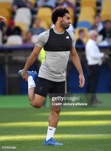 May 2018, Ukraine, Kiev: Football, Liverpool FC training: Mohamed Salah of Liverpool warming up during training at the Olimpiyskiy National Sports...