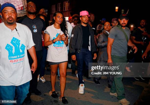 Musicians Jennifer Hudson and Chance the Rapper take part in the "End of School Year Peace March and Rally" in Chicago on June 15, 2018. - A...