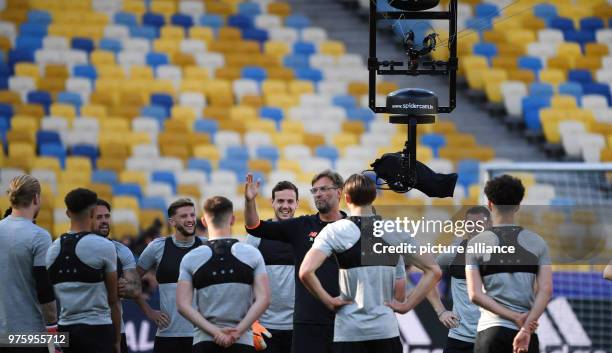 May 2018, Ukraine, Kiev: Football, Liverpool FC training: Coach Juergen Klopp gives an instruction to remove the TV camera during training at the...