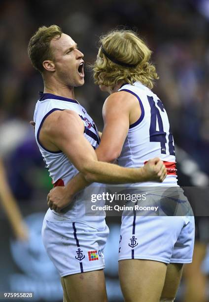 Brandon Matera of the Dockers is congratulated by Stefan Giro after kicking a goal during the round 13 AFL match between the Carlton Blues and the...