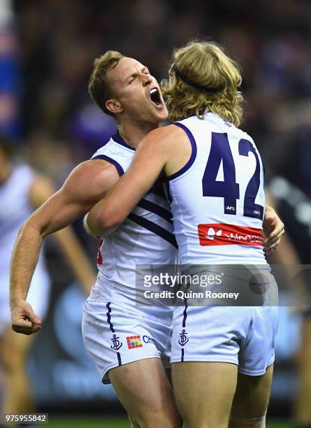Brandon Matera of the Dockers is congratulated by Stefan Giro after kicking a goal during the round 13 AFL match between the Carlton Blues and the...