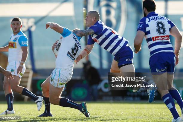 Jack Stockwell of the Titans is tackled high by David Klemmer of the Bulldogs during the round 15 NRL match between the Canterbury Bulldogs and the...
