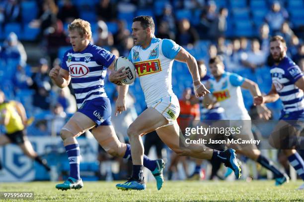 Michael Gordon of the Titans makes a break during the round 15 NRL match between the Canterbury Bulldogs and the Gold Coast Titans at Belmore Sports...