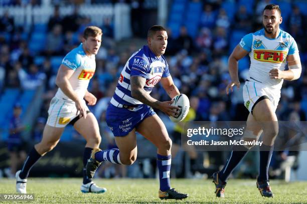 Michael Lichaa of the Bulldogs runs the ball during the round 15 NRL match between the Canterbury Bulldogs and the Gold Coast Titans at Belmore...