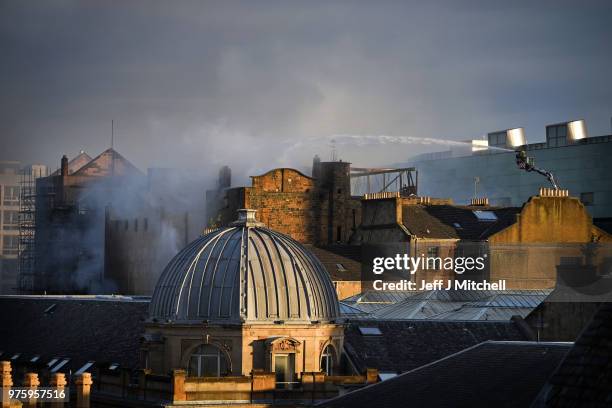 Fire fighters battle a blaze at the Mackintosh Building at the Glasgow School of Art for the second time in four years on June 16, 2018 in Glasgow,...