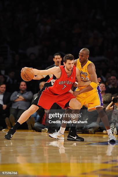 Andrea Bargnani of the Toronto Raptors posts up against Kobe Bryant of the Los Angeles Lakers at Staples Center on March 9, 2010 in Los Angeles,...