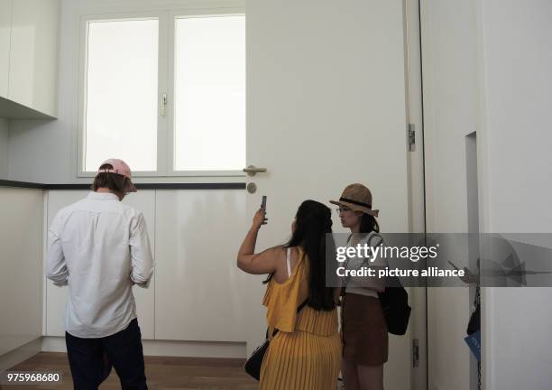 May 2018, Italy, Venice: Visitors walk through the "Svizzera 240" exhibition in the Swiss pavilion. The architecture group which designed the...