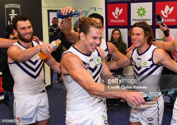 Nat Fyfe of the Dockers is sprayed with drinks in the rooms after winning the round 13 AFL match between the Carlton Blues and the Fremantle Dockers...