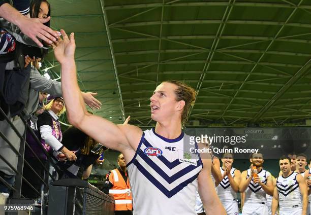 Nat Fyfe of the Dockers walks off the ground in game 150 after winning the round 13 AFL match between the Carlton Blues and the Fremantle Dockers at...