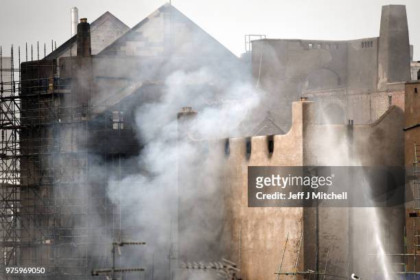 Fire fighters battle a blaze at the Glasgow School of Art for the second time in four years on June 16, Glasgow Scotland. In May 2014 it was...