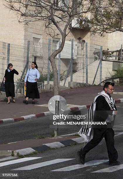 Jewish youths cross a street in Ramat Shlomo, a Jerusalem Jewish settlement, on March 10, 2010. Israel approved on March 9 building 1,600 new settler...