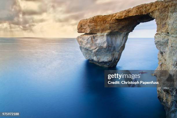 the serene azure window - dwejra stock pictures, royalty-free photos & images