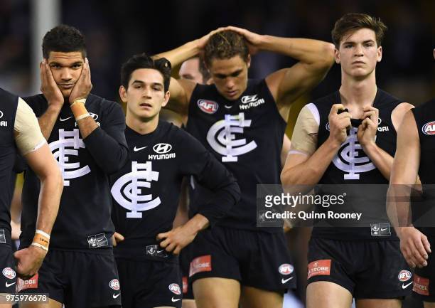 The Blues look dejected after losing the round 13 AFL match between the Carlton Blues and the Fremantle Dockers at Etihad Stadium on June 16, 2018 in...