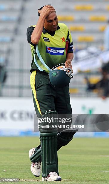 In this picture taken on April 8 Pakistani cricketer Younus Khan gestures as he walks back to the pavilion after his dismissal during the first...