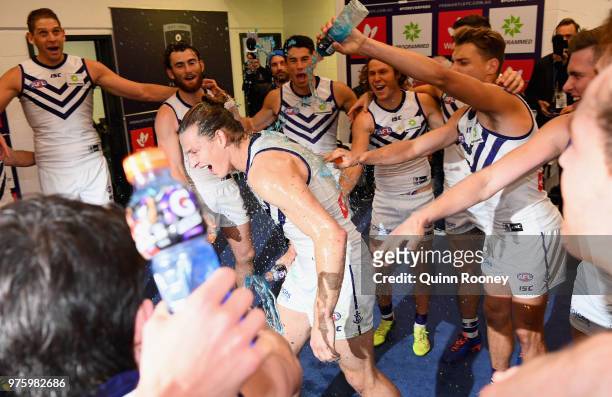 Nat Fyfe of the Dockers is sprayed with drinks in the rooms after winning the round 13 AFL match between the Carlton Blues and the Fremantle Dockers...