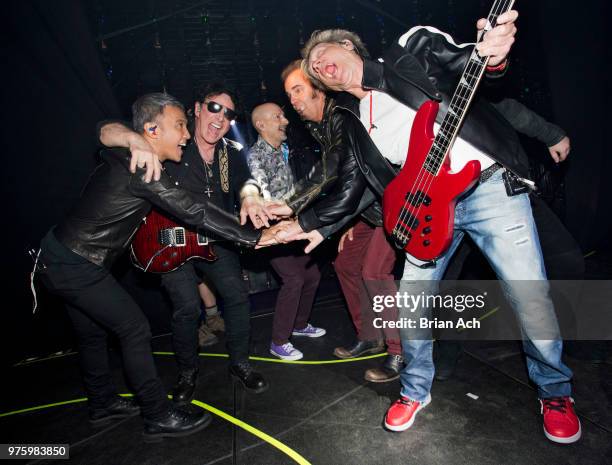 Singer Arnel Pineda, founder and guitarist Neal Schon, drummer Steve Smith, keyboardist Jonathan Cain, and bassist Ross Valory of the band Journey...