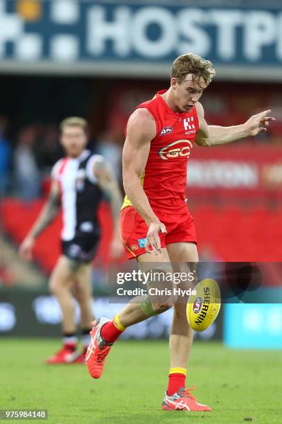 Tom Lynch of the Suns kicks during the round 13 AFL match between the Gold Coast Suns and the St Kilda Saints at Metricon Stadium on June 16, 2018 in...