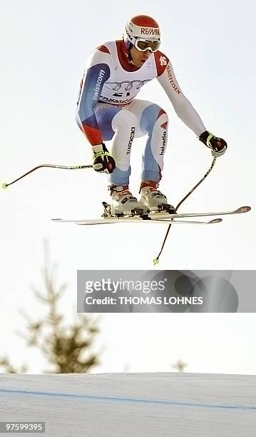 Switzerland's Tobias Gruenenfelder jumps during the Men's Downhill at the Alpine skiing World Cup in Garmisch Partenkirchen, southern Germany on...