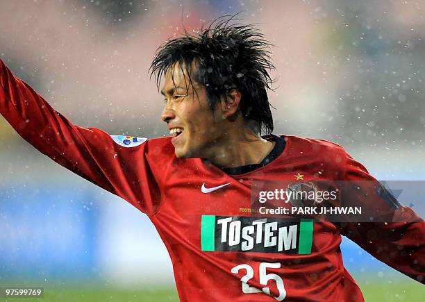 Endoh Yasushi of Japan's Kashima Antlers celebrates his goal against South Korea's Jeonbuk Motors during a preliminary Group F match of the AFC...