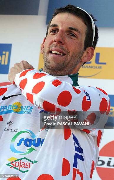 France's Saur-Sojasun cycling team's France's Laurent Mangel celebrates on the podium his polka dot jersey of best climber on March 9, 2010 at the...
