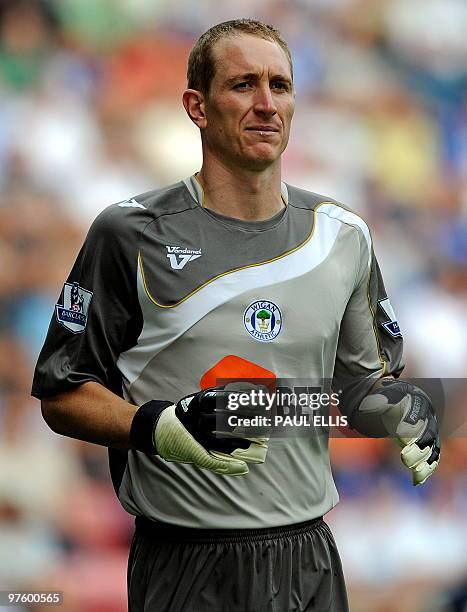 Wigan Athletic's English goalkeeper Chris Kirkland in action during their English Premier League football match against Manchester United at the DW...