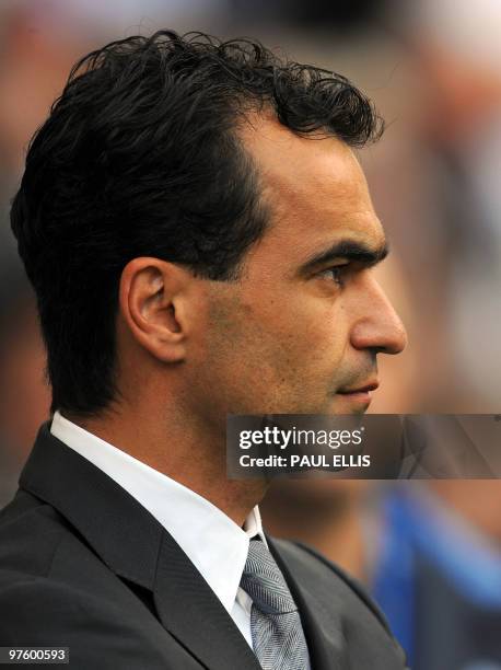 Wigan Athletic's Spanish manager Roberto Martinez looks on during their English Premier League football match against Manchester United at the DW...