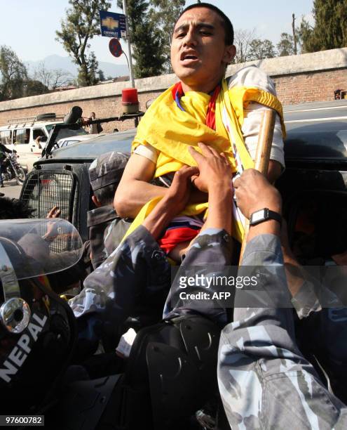 Nepalese riot police arrest Tibetan protesters in front of the consular section of the Chinese Embassy in Kathmandu on March 10 as they stage a...