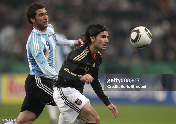 Serdar Tasci of Germany battles for the ball with Gonzalo Higuain of Argentina during the International Friendly match between Germany and Argentina...