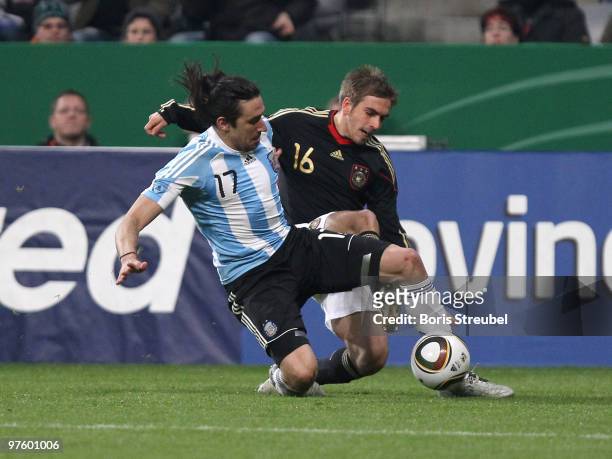 Philipp Lahm of Germany battles for the ball with Jonas Gutierrez of Argentina during the International Friendly match between Germany and Argentina...