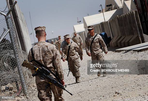 Task Force Leatherneck Marines walk at Camp Bastion in Helmand province on March 10, 2010. On his ongoing tour of the country, US Secretary of...