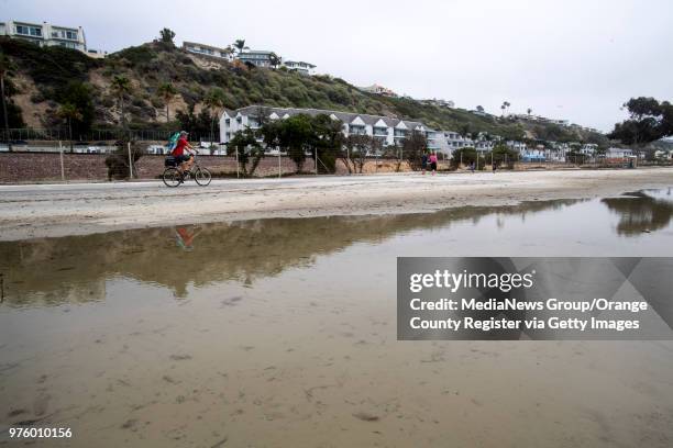 Pool of sea water lies in the parking lot at Doheny State Beach in Dana Point on Wednesday, June 13, 2018. High tides should decrease later in the...
