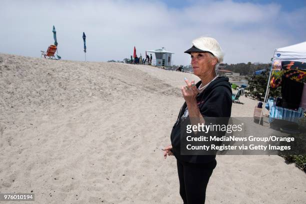 Linn Horn of Palm Springs talks about waves coming over the berm while camping at Doheny State Beach in Dana Point on Wednesday, June 13, 2018. Her...