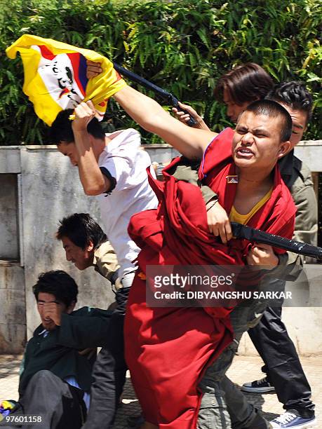 Tibetan students and monks particiapte in a street drama during a demonstration in Bangalore on March 10, 2010. The demonstration marked the 51st...