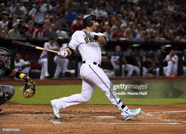 Daniel Descalso of the Arizona Diamondbacks follows through on a swing against the Pittsburgh Pirates at Chase Field on June 12, 2018 in Phoenix,...