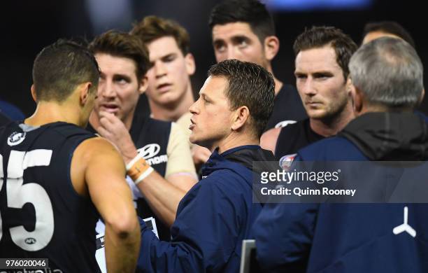 Blues head coach Brendon Bolton speaks to his players during the round 13 AFL match between the Carlton Blues and the Fremantle Dockers at Etihad...